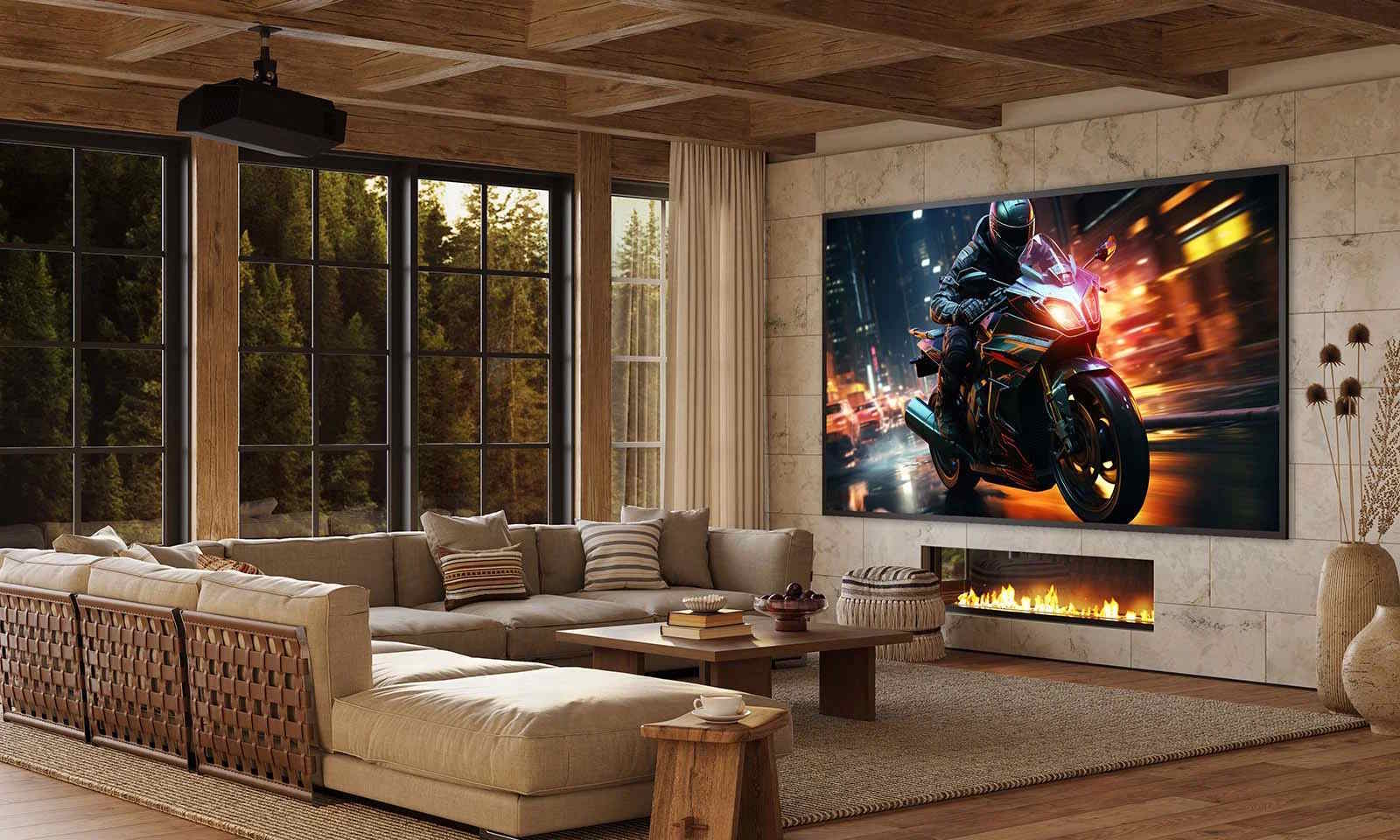 A modern home theater living room with a large projector screen displaying a motorcyclist speeding at night, a sectional sofa, a fireplace built into the wall, and large windows overlooking trees.